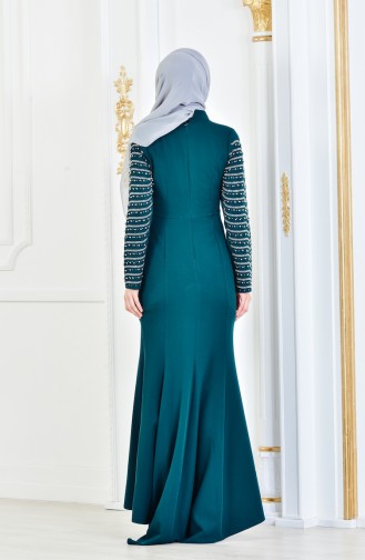 فستان سهرة يتميز بتفاصيل من الؤلؤ 6047-07 لون اخضر زُمردي 6047-07