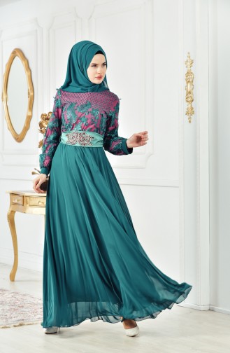 فستان يتميز بتفاصيل من الترتر 2623-01 لون اخضر زمردي وفوشي \ 2623-01