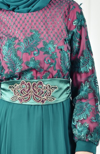 فستان يتميز بتفاصيل من الترتر 2623-01 لون اخضر زمردي وفوشي \ 2623-01