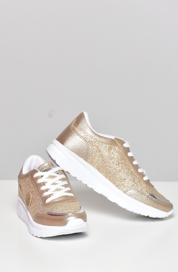 gold sport shoes