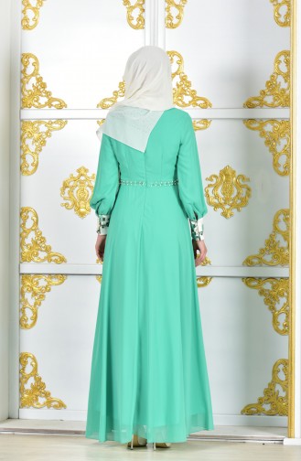 فستان سهرة يتميز بتفاصيل من الدانتيل 2312-05 لون اخضر مائل للازرق فاتح 2312-05