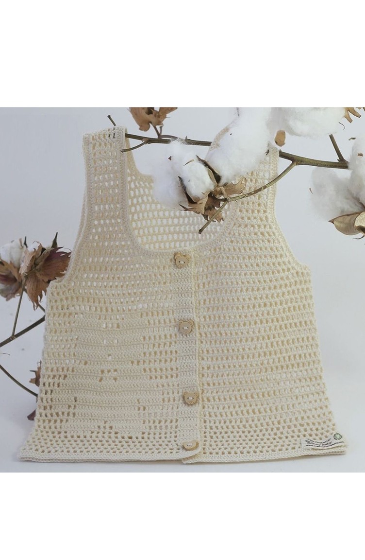cream baby vest